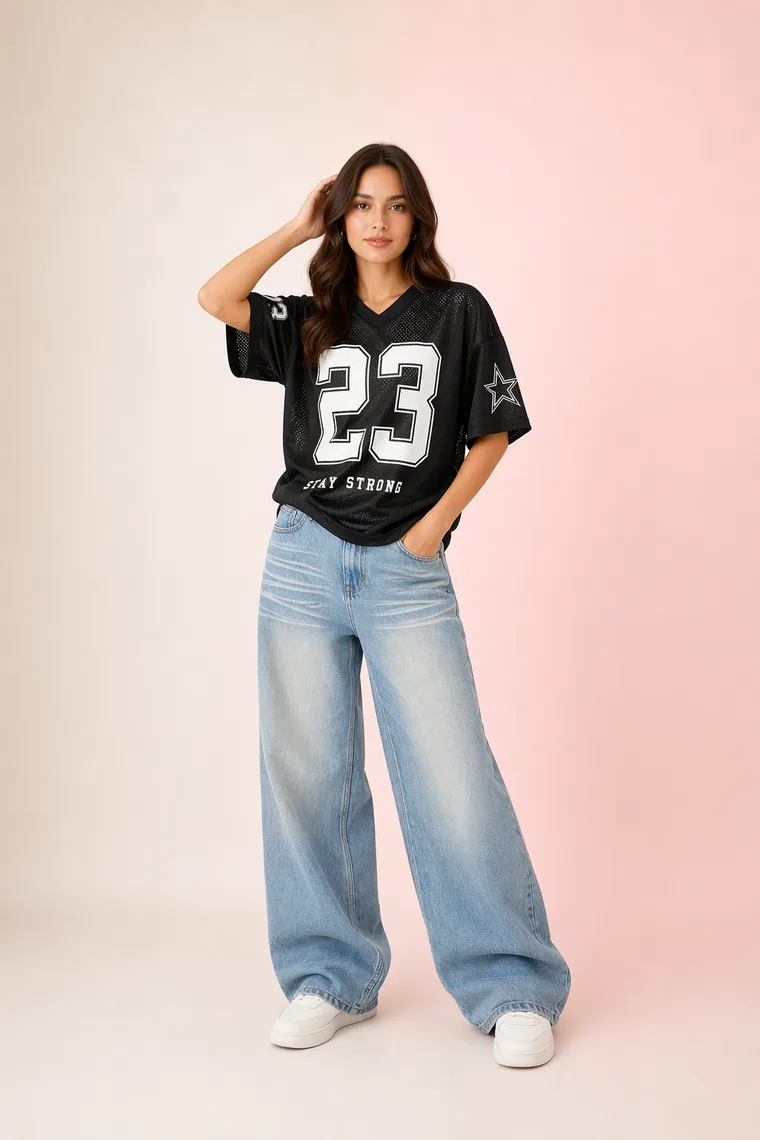 Model in a jersey and baggy jeans streetwear look